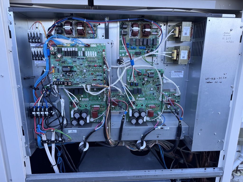 Air-conditioning control boards being inspected and repaired